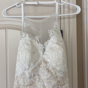 Beautiful lace wedding dress with sheer lace train